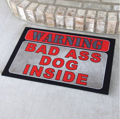 warning dog inside door mat