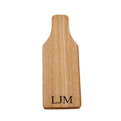 paddle shaped cheeseboard with utensils