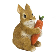 bunny holding carrot figurine