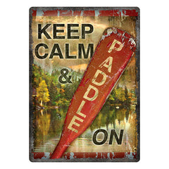 keep calm and paddle on tin sign