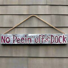 no peein' off the dock sign